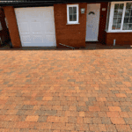 Pressure washing driveway in FAQ, Williams Exterior Shine.