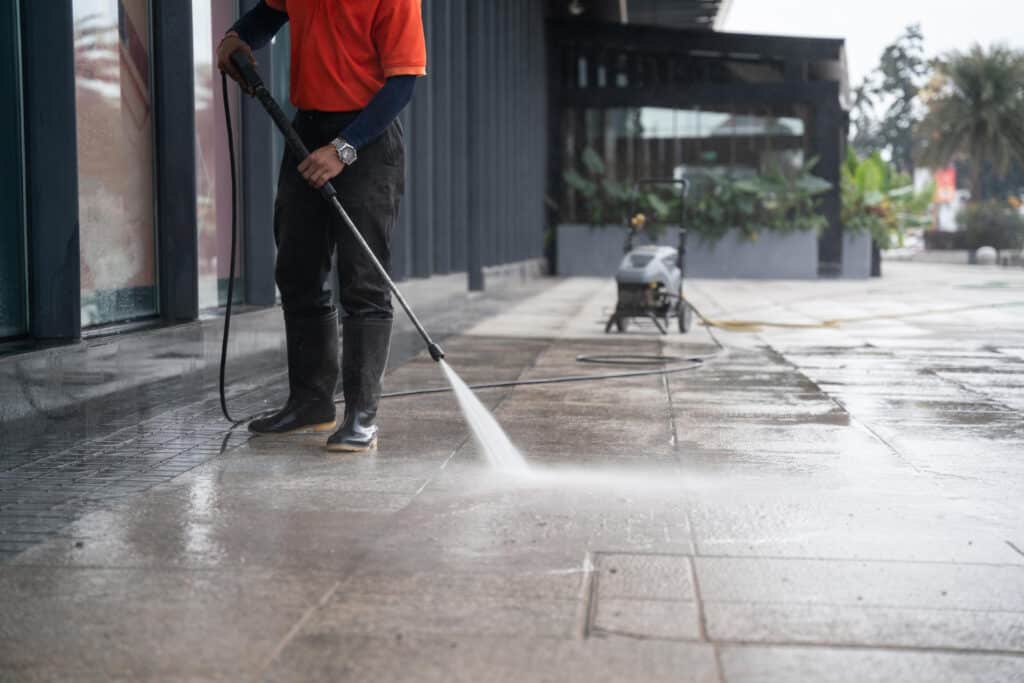Pressure washing concrete pavement in Stoke-on-Trent for a clean, restored surface.