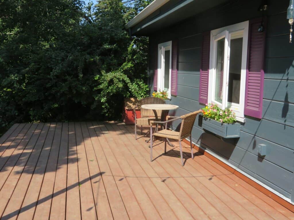 Pressure washing deck surface in Staffordshire – revitalised and clean.
